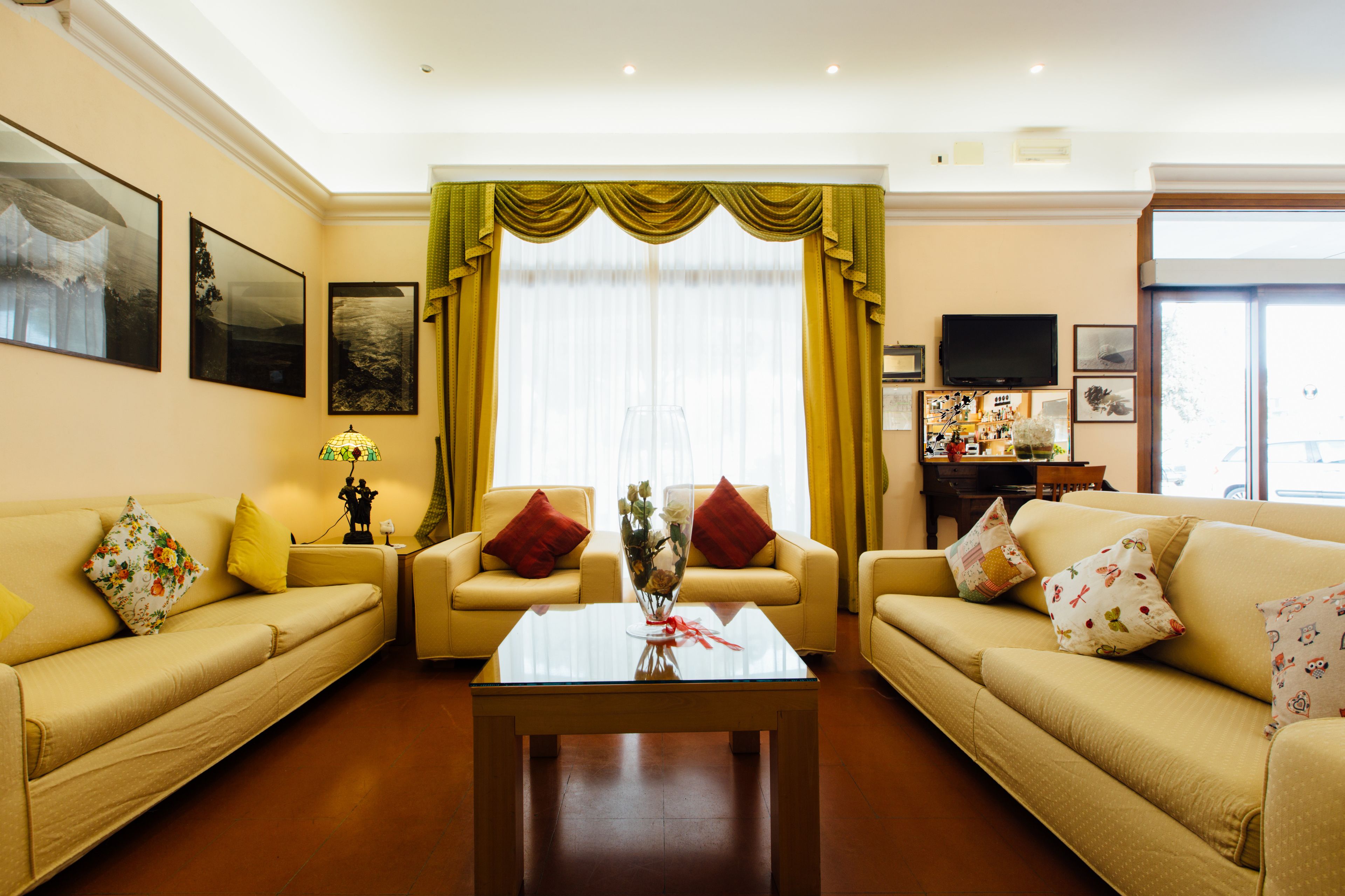 A living room with two sofas, a coffee table, and a television.