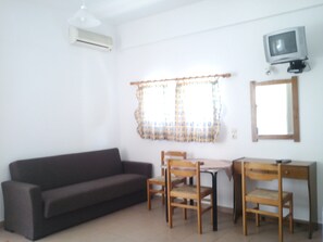 Standard Studio, Balcony, Ground Floor | Living area | 24-inch flat-screen TV with satellite channels, TV - Dimitra Apartments (Hersonissos)
