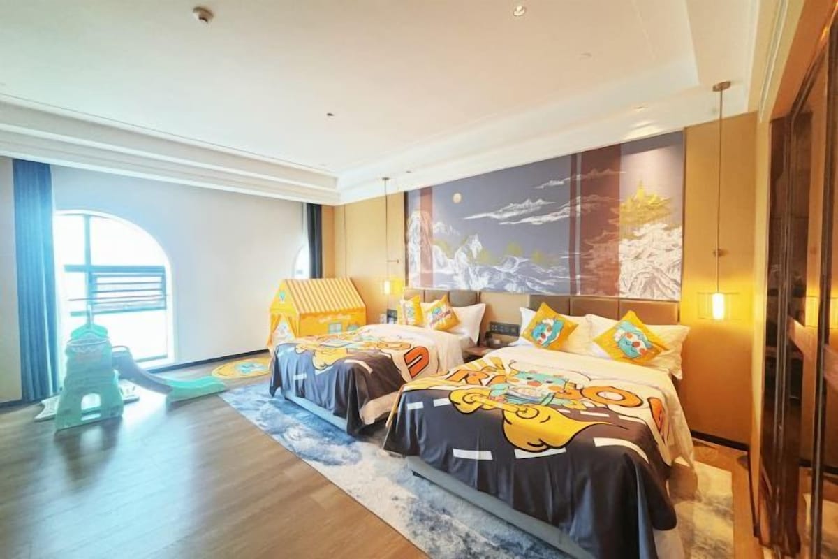 A hotel room with two beds, a large window, and a view of the outdoors.