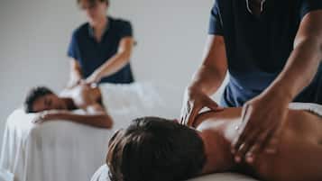 Experience a soothing massage in a serene, space with a dedicated massage table and expert care.