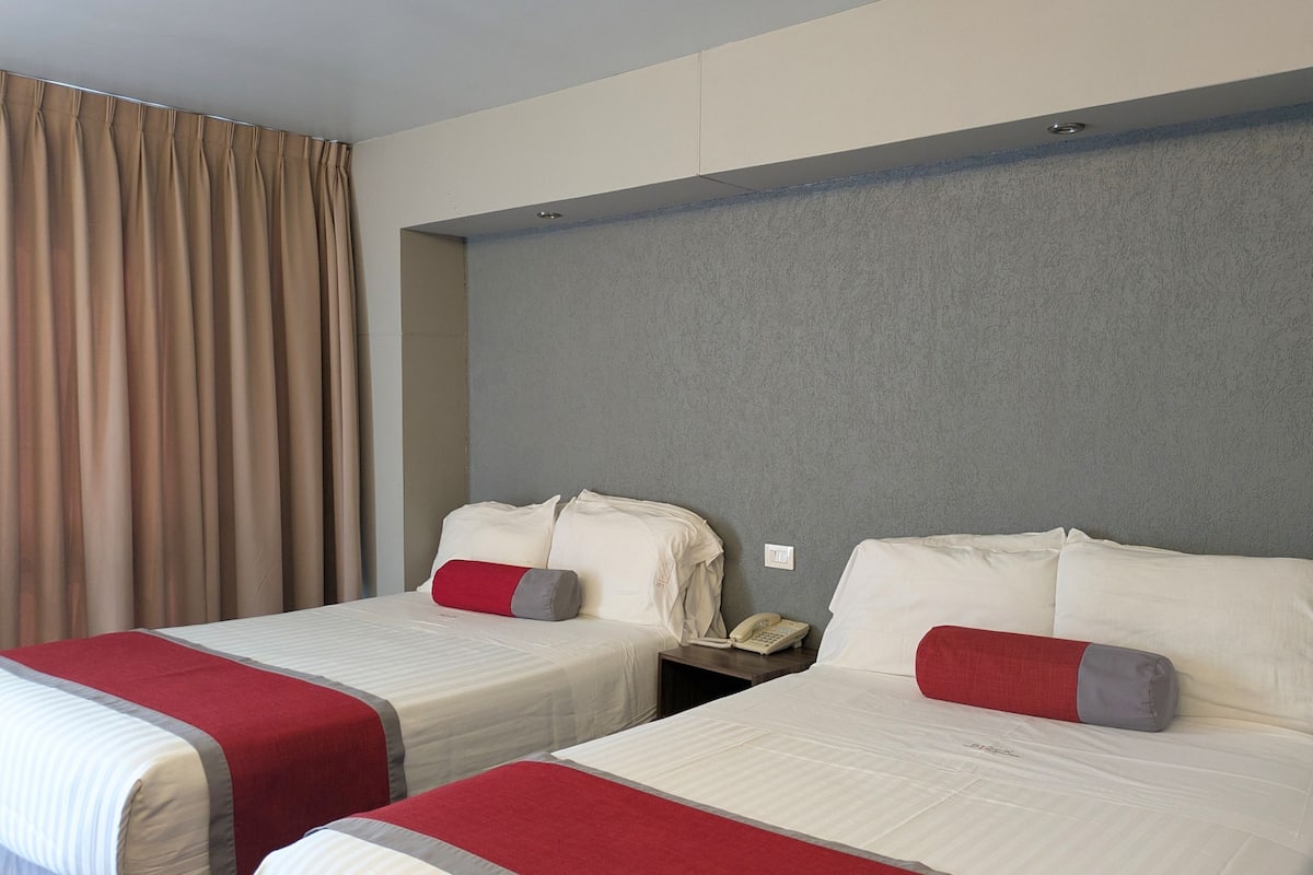 Economy Room, 2 Double Beds | In-room safe, desk, soundproofing, iron/ironing board
