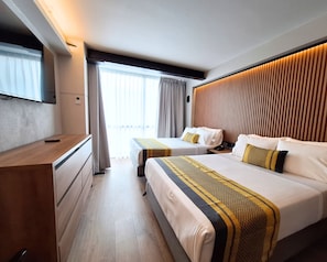 Standard Quadruple Room, 2 Double Beds | In-room safe, desk, soundproofing, iron/ironing board