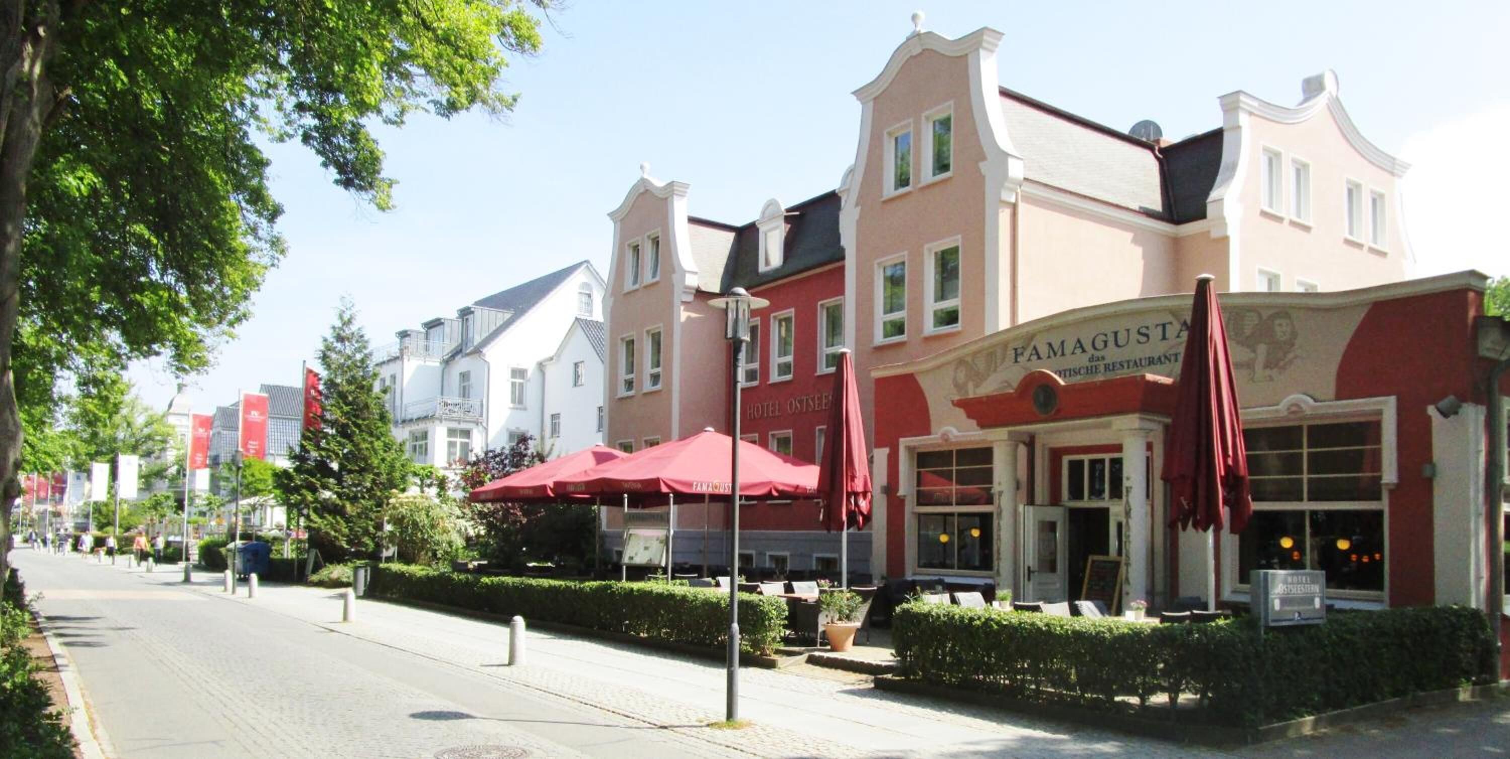 A hotel with a red awning and a sign that reads "FAMAGUSTA HOTEL OSTESEE".