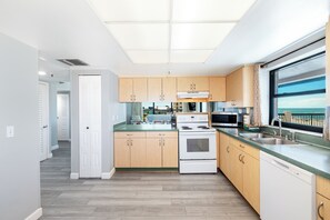 Large Balcony 2 bedroom (AS-C) | Private kitchen | Full-sized fridge, microwave, oven, stovetop - All Seasons Vacation Resort by Liberte' (Madeira Beach)