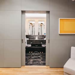 Relax in a stylish space with a wardrobe and comfortable seating area.