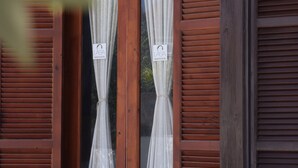 A wooden door with two glass panels and a sign that reads "LASA HOTEL." - Lasa Heights (Lasa)