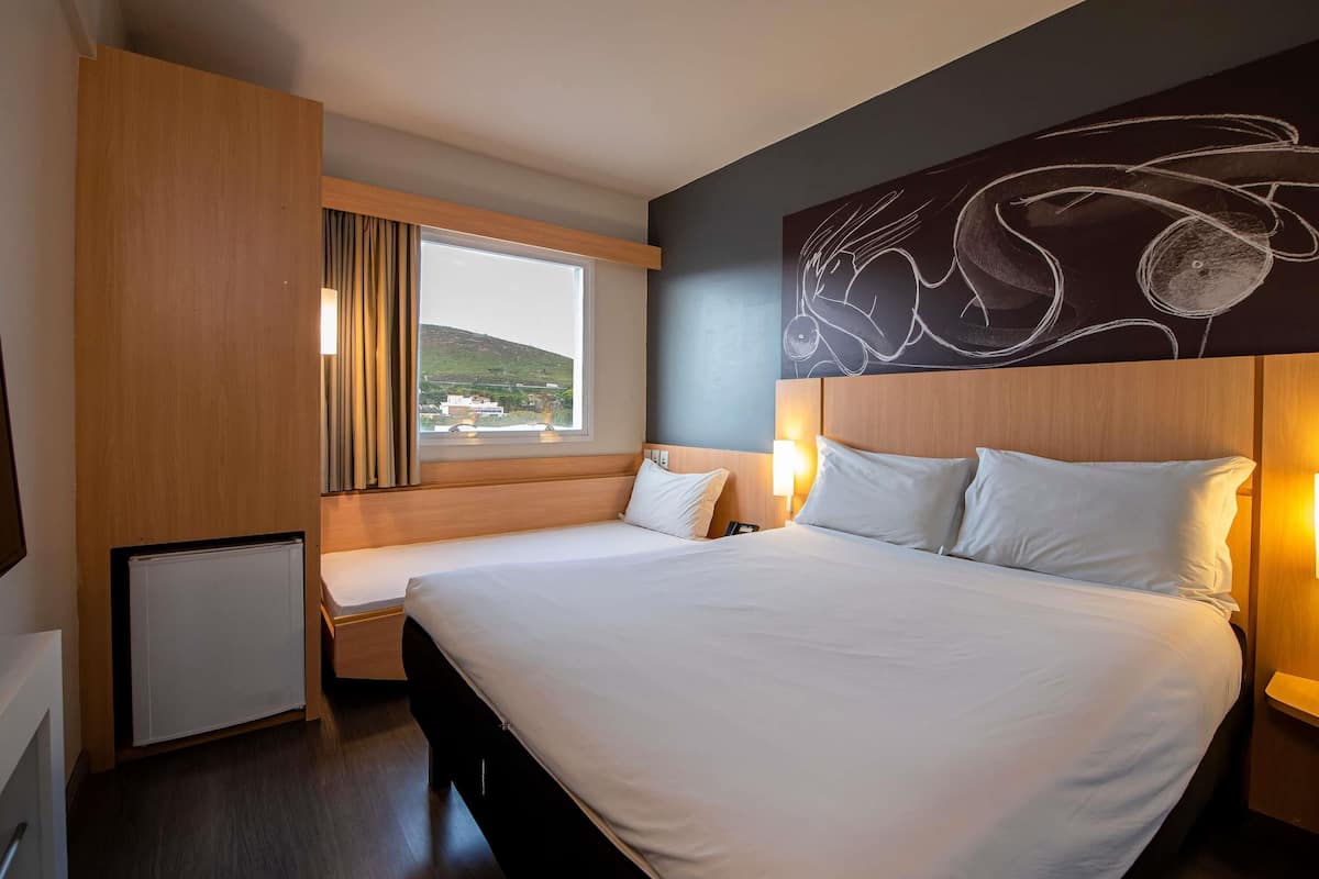 Standard Apartment, Multiple Beds | Minibar, in-room safe, desk, blackout drapes