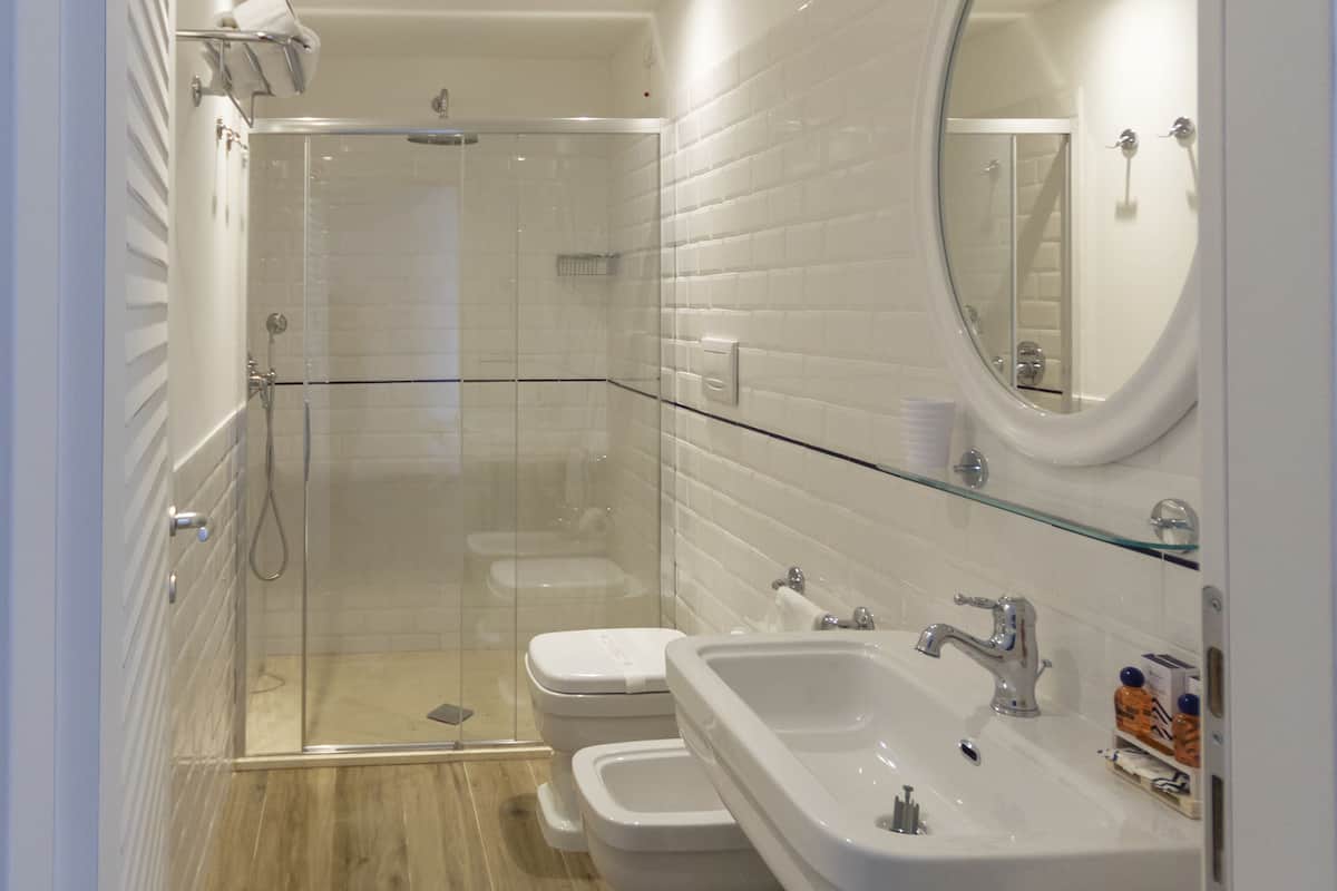 junior suite, 1 king bed, hot tub | bathroom | shower, rainfall showerhead, free toiletries, hair dryer