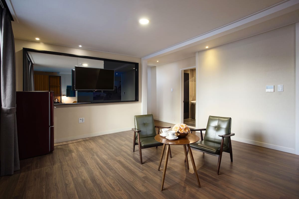 Triple Room | Down comforters, in-room safe, desk, blackout drapes