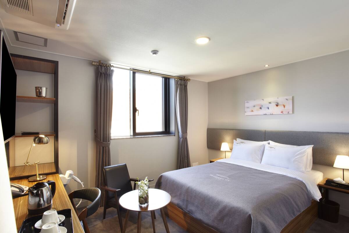 Standard Double Room | Down comforters, in-room safe, desk, blackout drapes