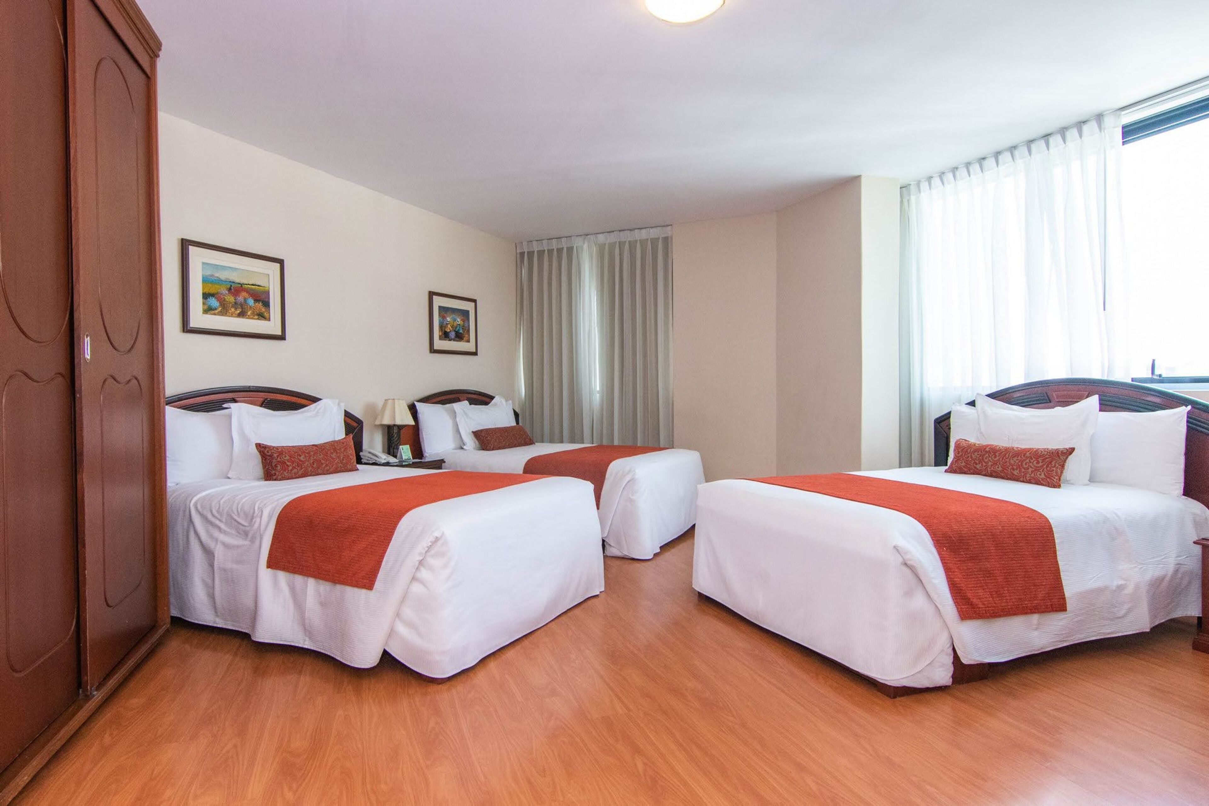 deluxe triple room | premium bedding, minibar, in-room safe, iron/ironing board