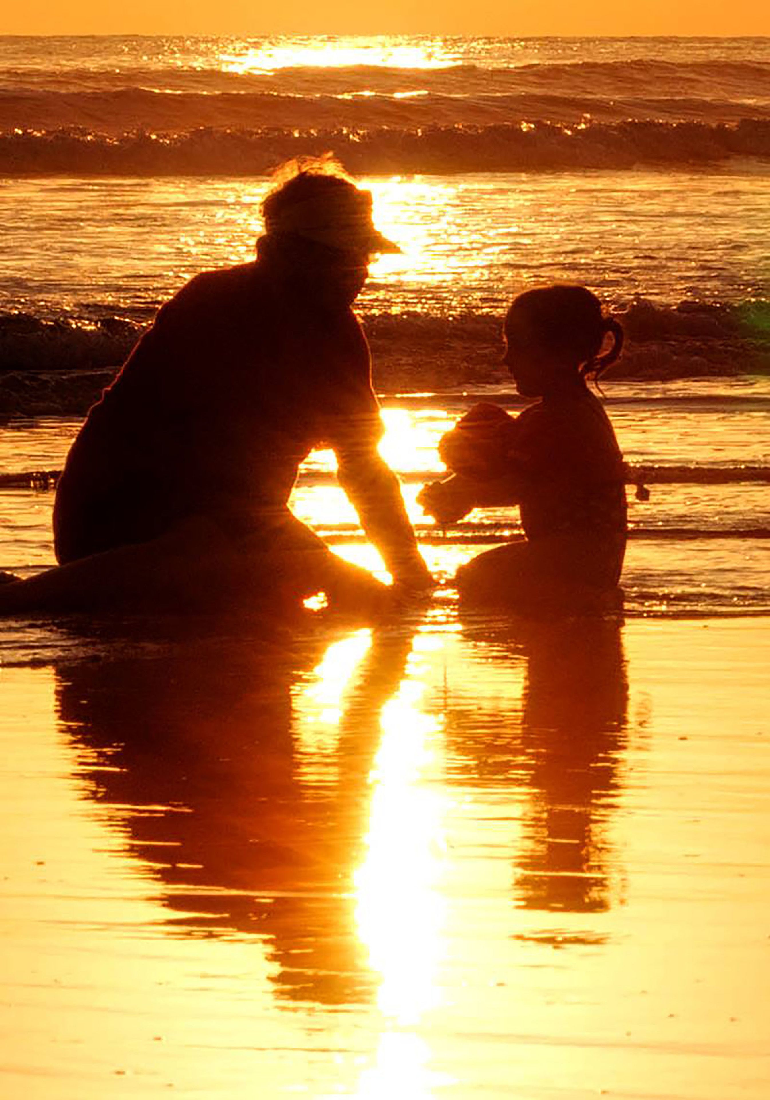 on the beach, free beach cabanas, beach umbrellas, surfing