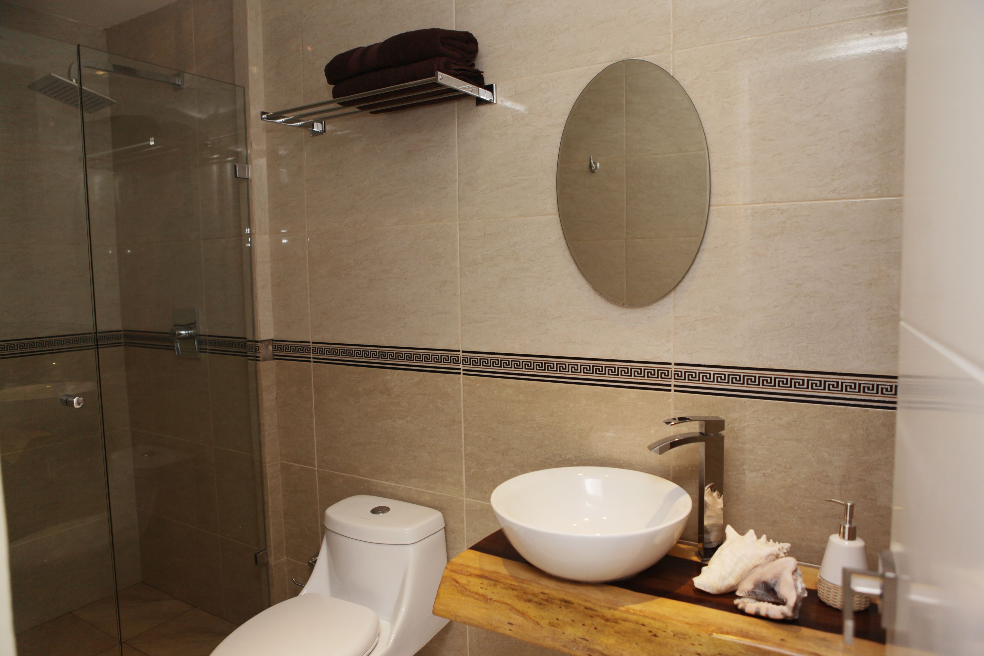 Studio Suite | Bathroom | Shower, hair dryer, towels, toilet paper