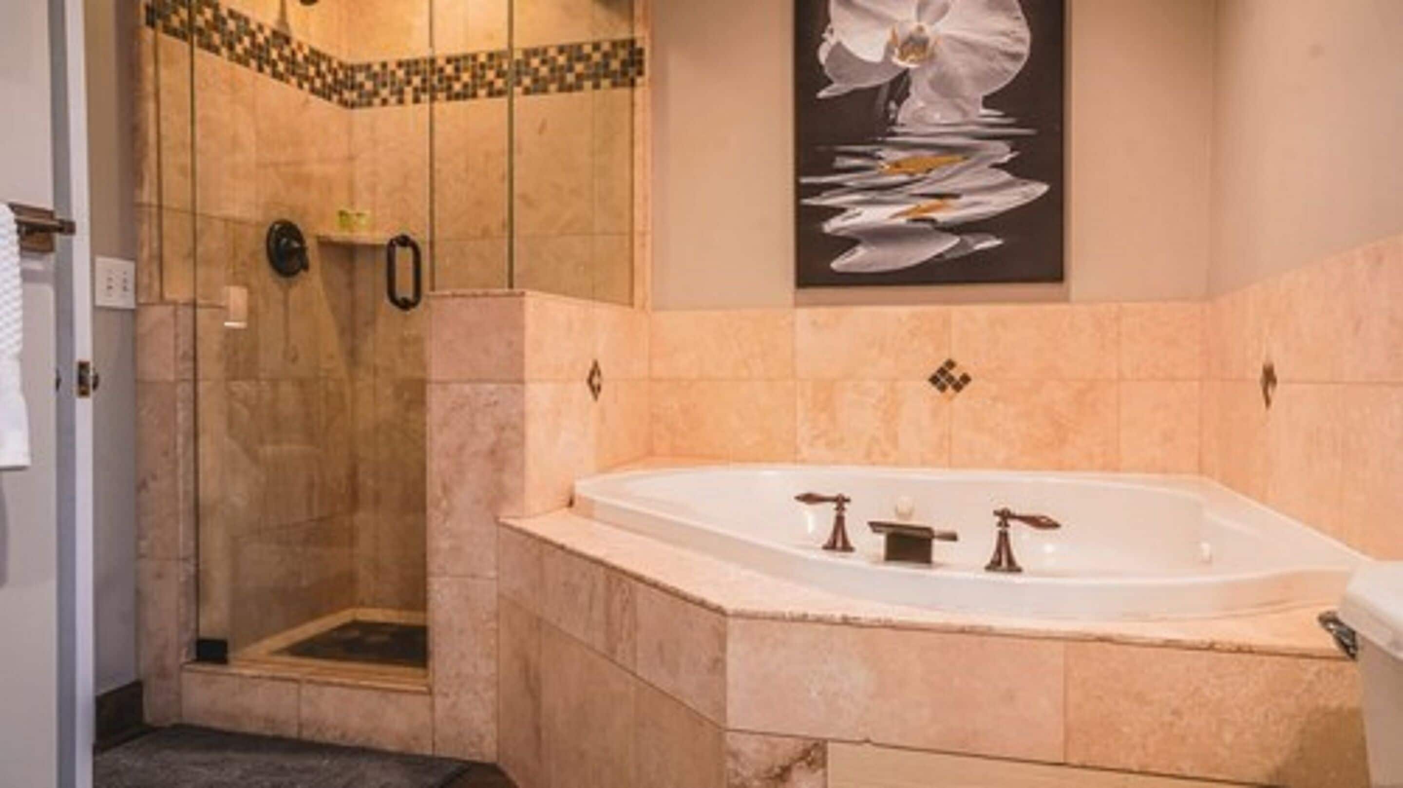 deluxe suite, 1 king bed | bathroom | free toiletries, hair dryer, towels