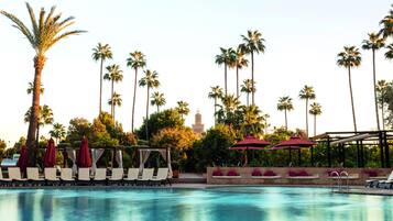 2 outdoor pools, open 10:00 AM to 6:00 PM, pool umbrellas, pool loungers