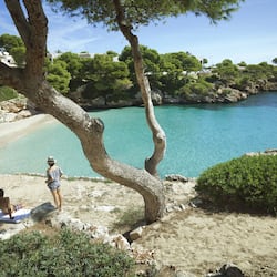 On the beach, white sand, sun-loungers, beach umbrellas