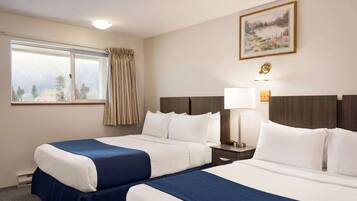 Desk, blackout drapes, iron/ironing board, rollaway beds