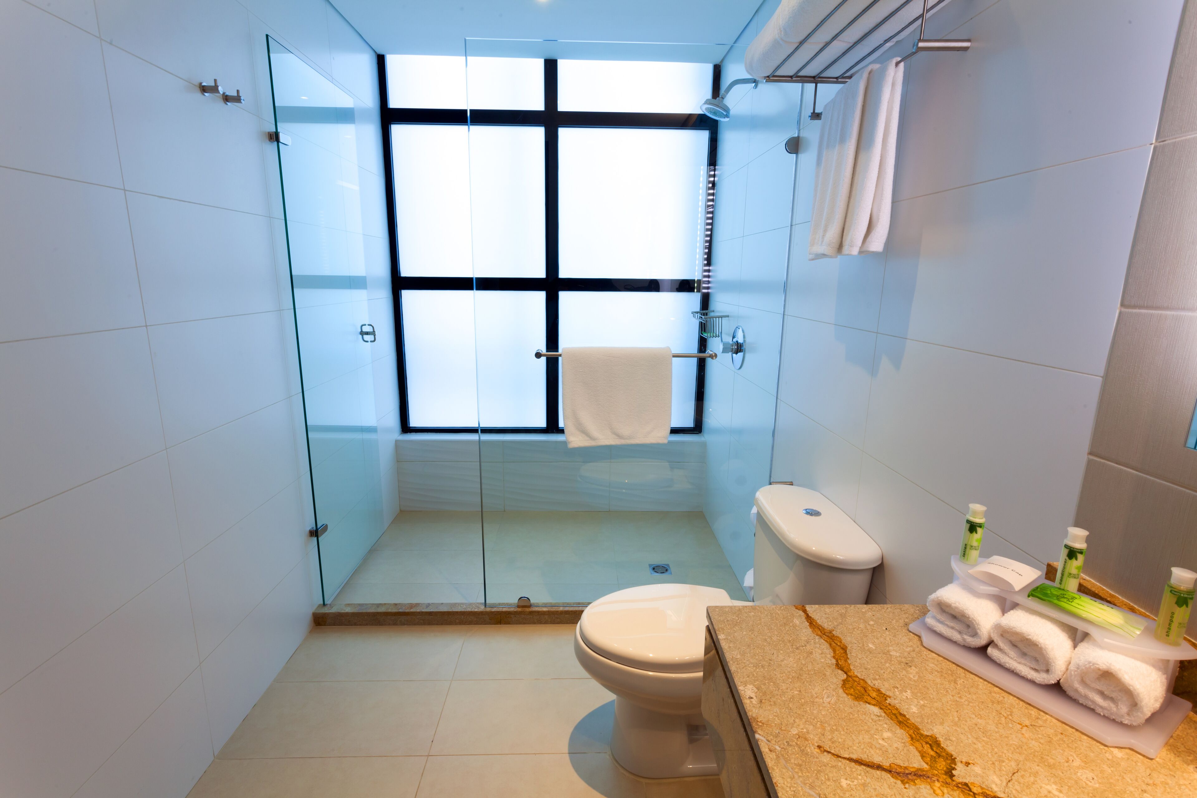 shower, rainfall showerhead, hair dryer, towels