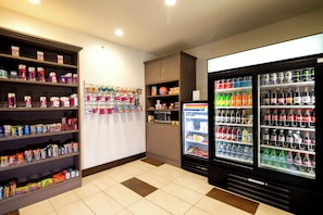 A vending area with snack and drink options, including microwaves and refrigerators. - Holiday Inn Express & Suites Rochester Hill - Detroit Area by IHG (Rochester)
