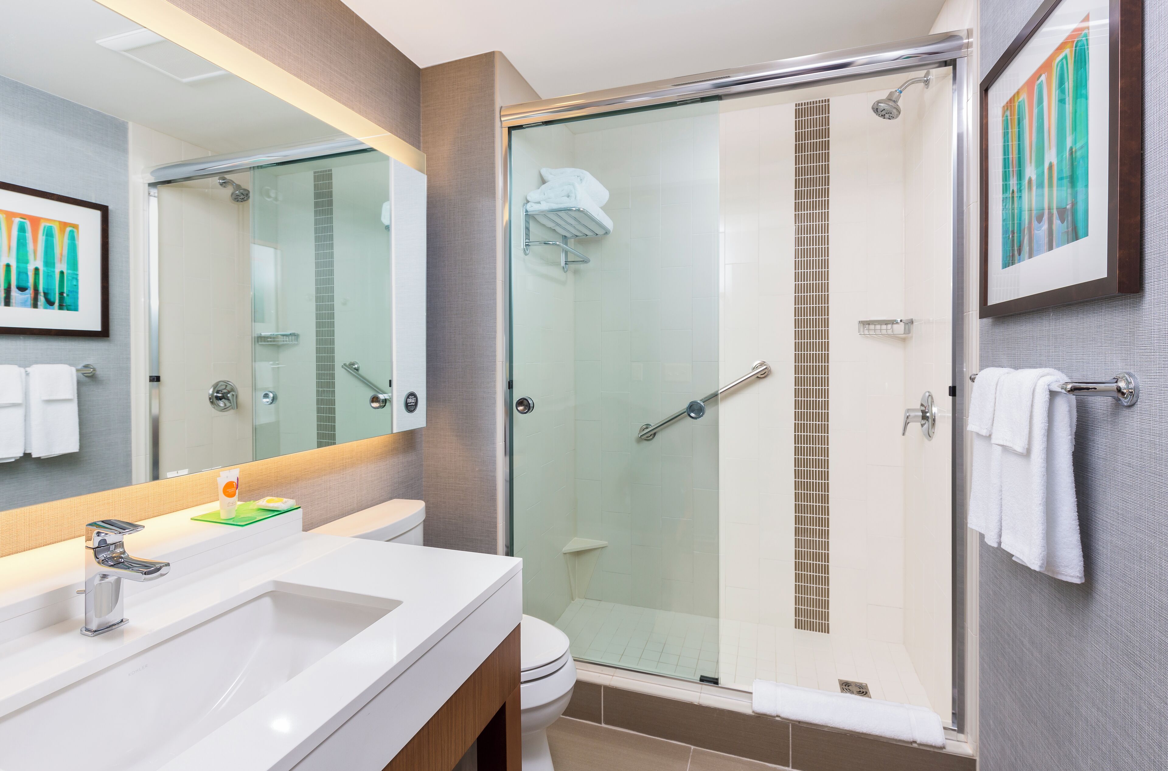 designer toiletries, hair dryer, towels