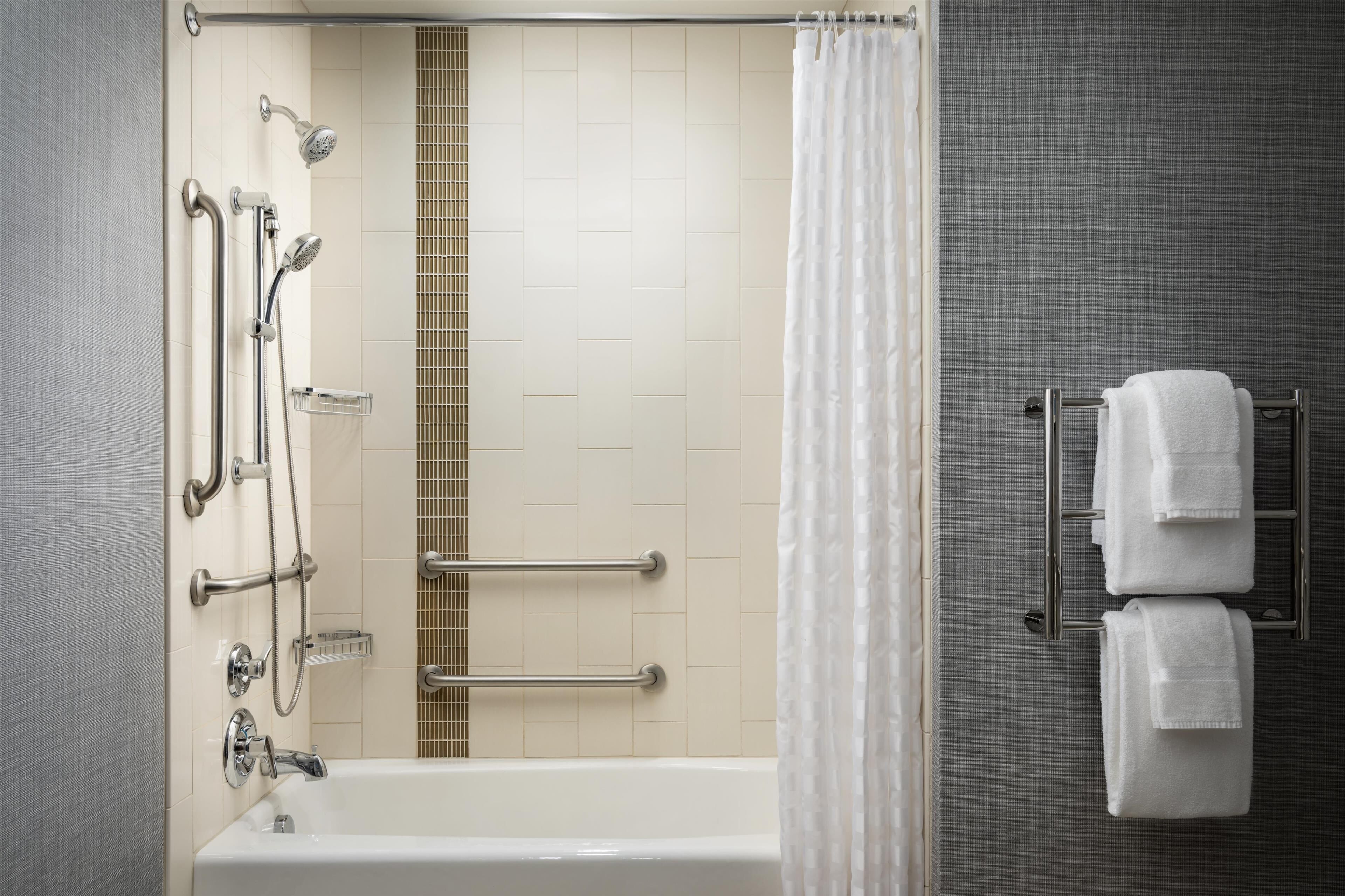 designer toiletries, hair dryer, towels