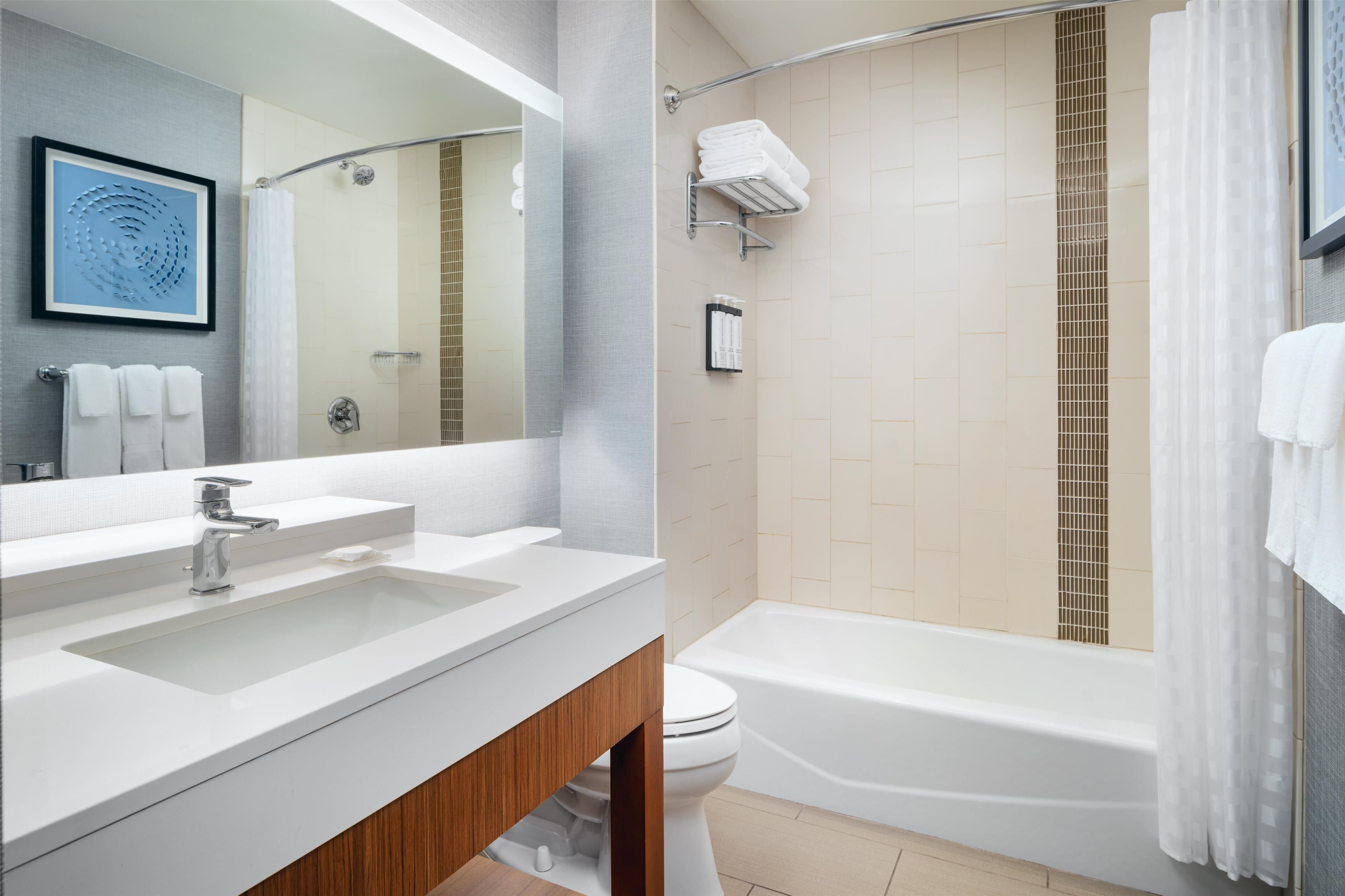 room, 2 queen beds | bathroom | designer toiletries, hair dryer, towels