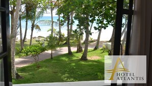 A view from a window of a hotel with a logo 'Hotel Atlantis'. - Hotel Atlantis (Las Terrenas)