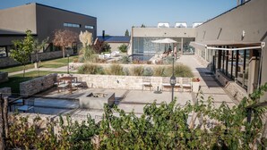 A courtyard with outdoor seating, a fire pit, and a pool area. - Auberge Du Vin, Tupungato, Mendoza (Tupungato)