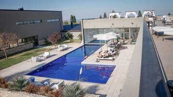 Outdoor pool, open 8:00 AM to 10:00 PM, pool umbrellas