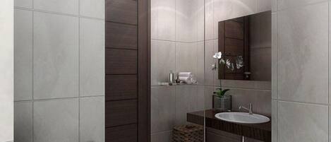 Un baño moderno con una puerta de madera oscura, un lavamanos blanco y un espejo encima.