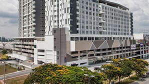 A modern hotel with a prominent 'Citadines' sign, multiple floors, and a parking structure. - Citadines DPulze Cyberjaya (Cyberjaya)