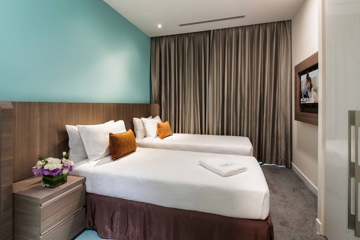 Premium bedding, down duvets, in-room safe, desk