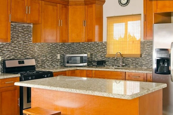 Townhome | Private kitchen | Full-size fridge, microwave, oven, stovetop