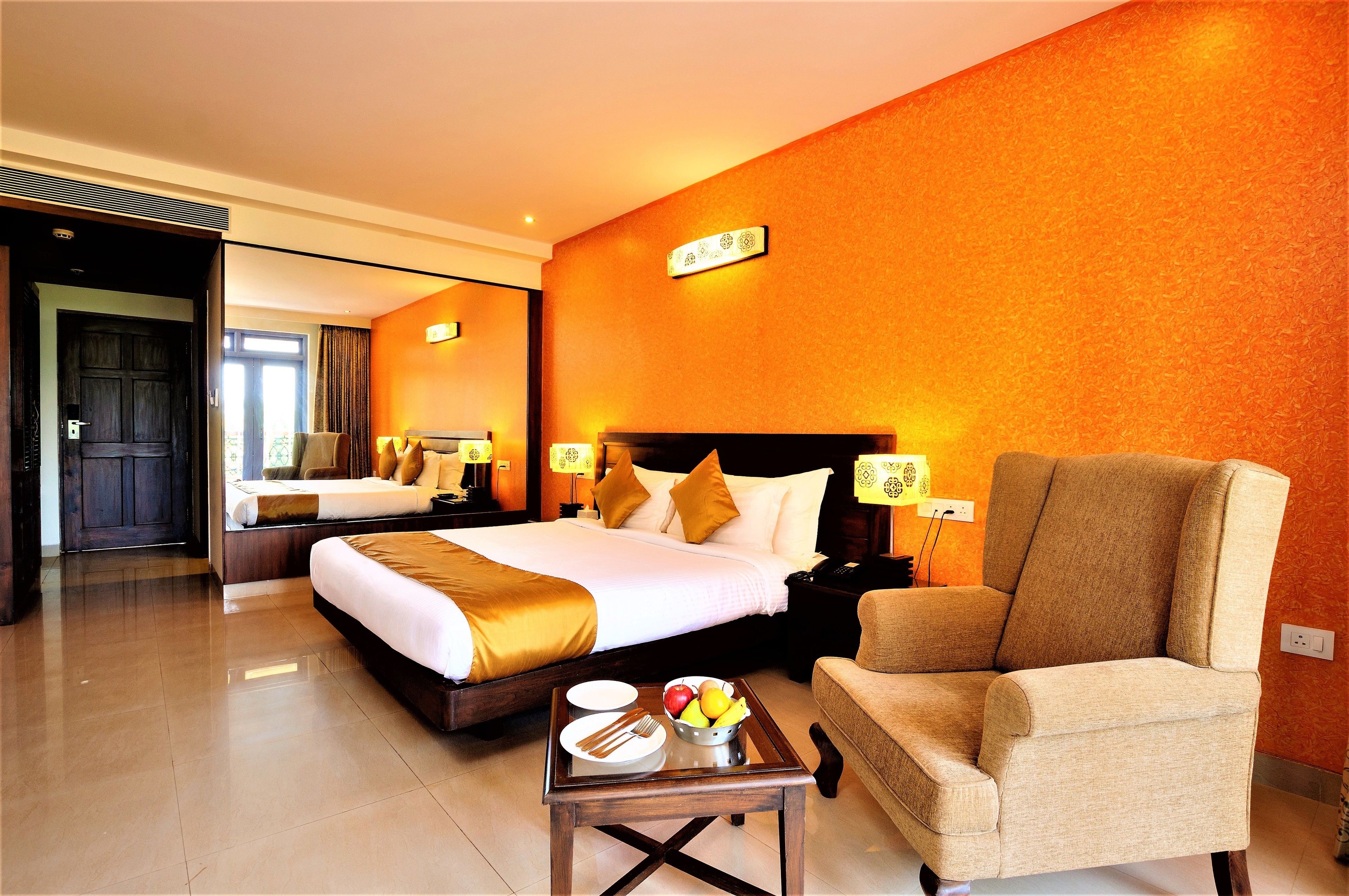 deluxe room | minibar, in-room safe, blackout curtains, iron/ironing board