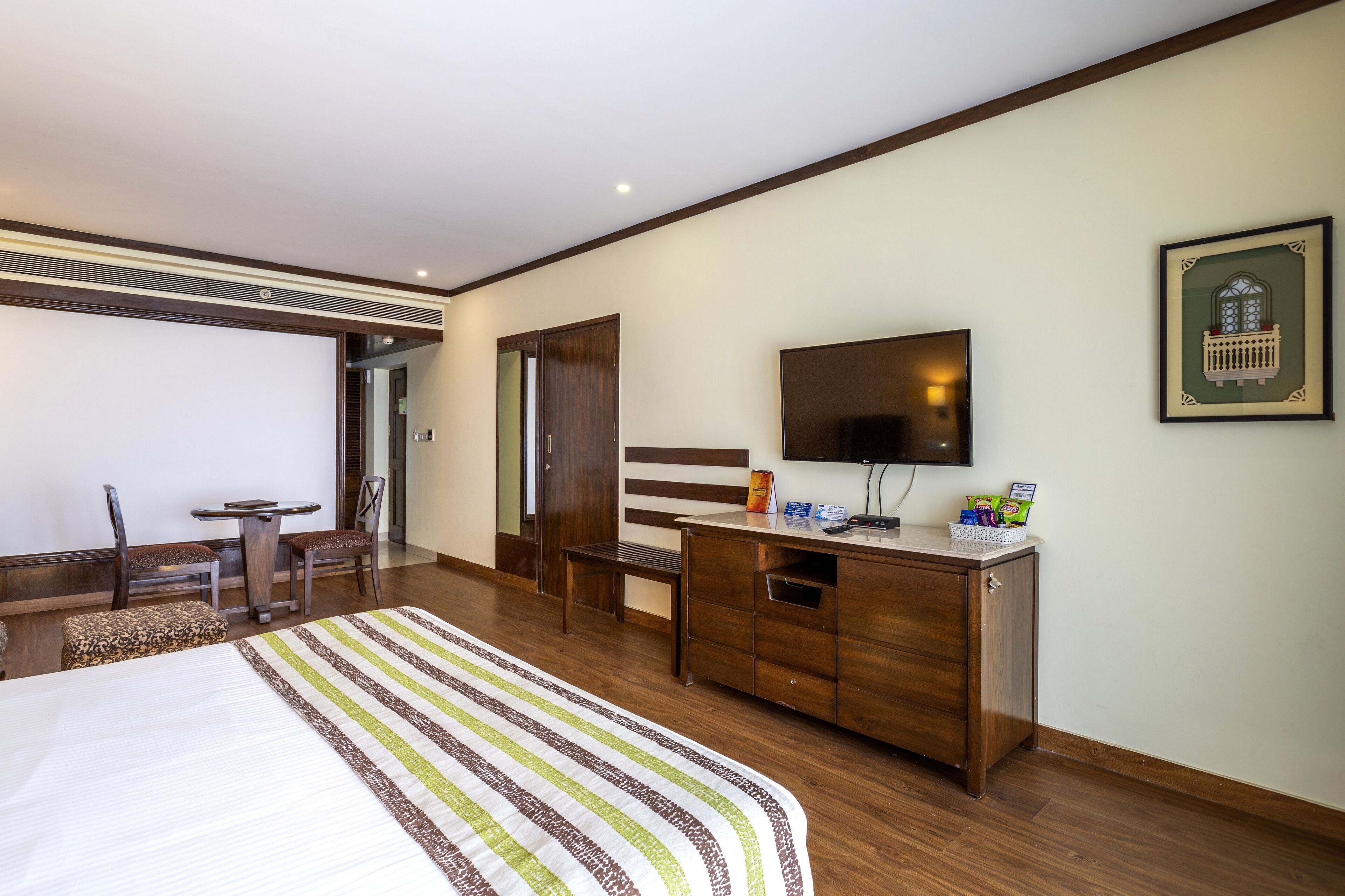 luxury room, city view | minibar, in-room safe, blackout curtains, iron/ironing board