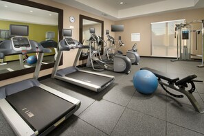 A fitness center with treadmills, elliptical machines, and a weight machine. - Holiday Inn Express & Suites Waco South by IHG (Waco)