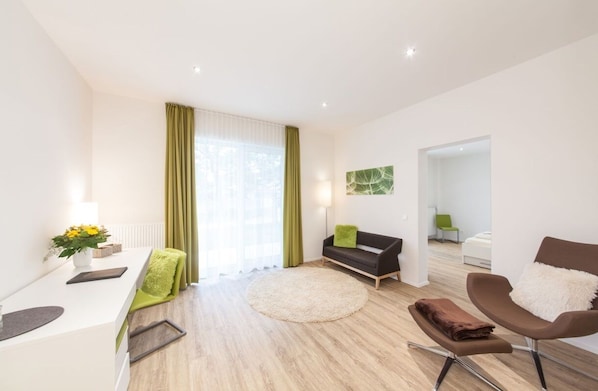 Apartment, 1 Bedroom (Up to 4 Guests) | Hypo-allergenic bedding, in-room safe, individually furnished, desk