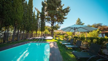 Seasonal outdoor pool, open 10:00 AM to 7:00 PM, sun loungers