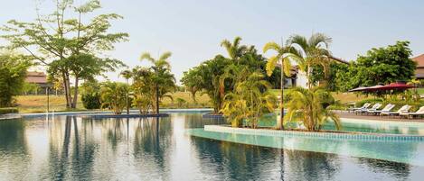 Outdoor pool, pool umbrellas, sun loungers