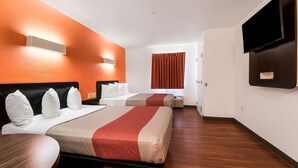 A hotel room with two beds, a TV, and a desk. - Motel 6 Wilkes Barre, PA - Arena (Wilkes-Barre)