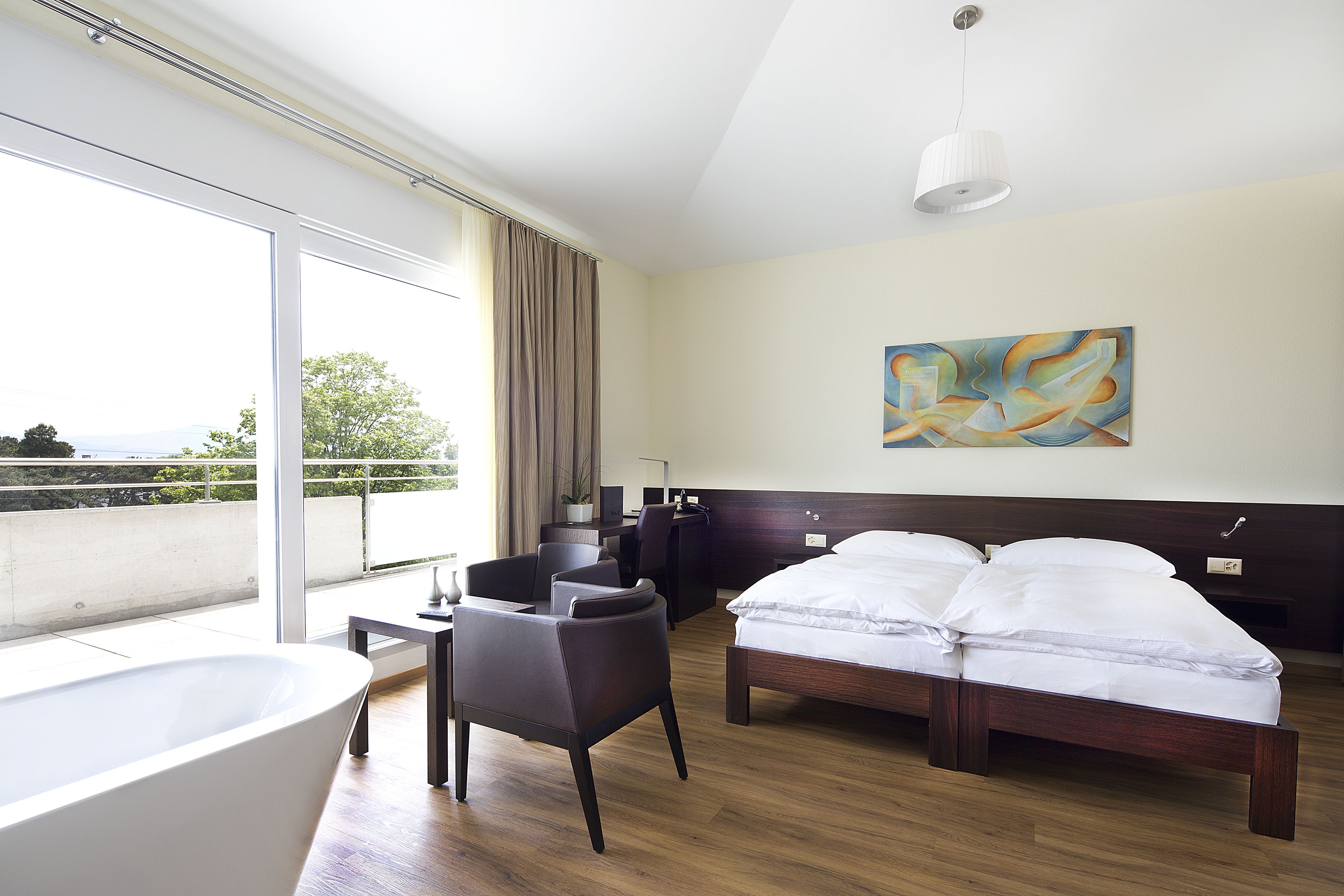 junior double room, bathtub, lake view | premium bedding, in-room safe, individually decorated, desk