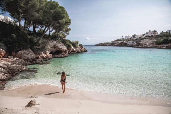 Beach nearby, white sand, sun loungers, beach umbrellas