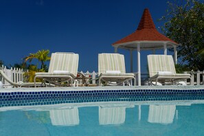 Outdoor pool, pool umbrellas, sun loungers