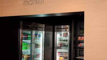 A vending machine with a variety of drinks and snacks.
