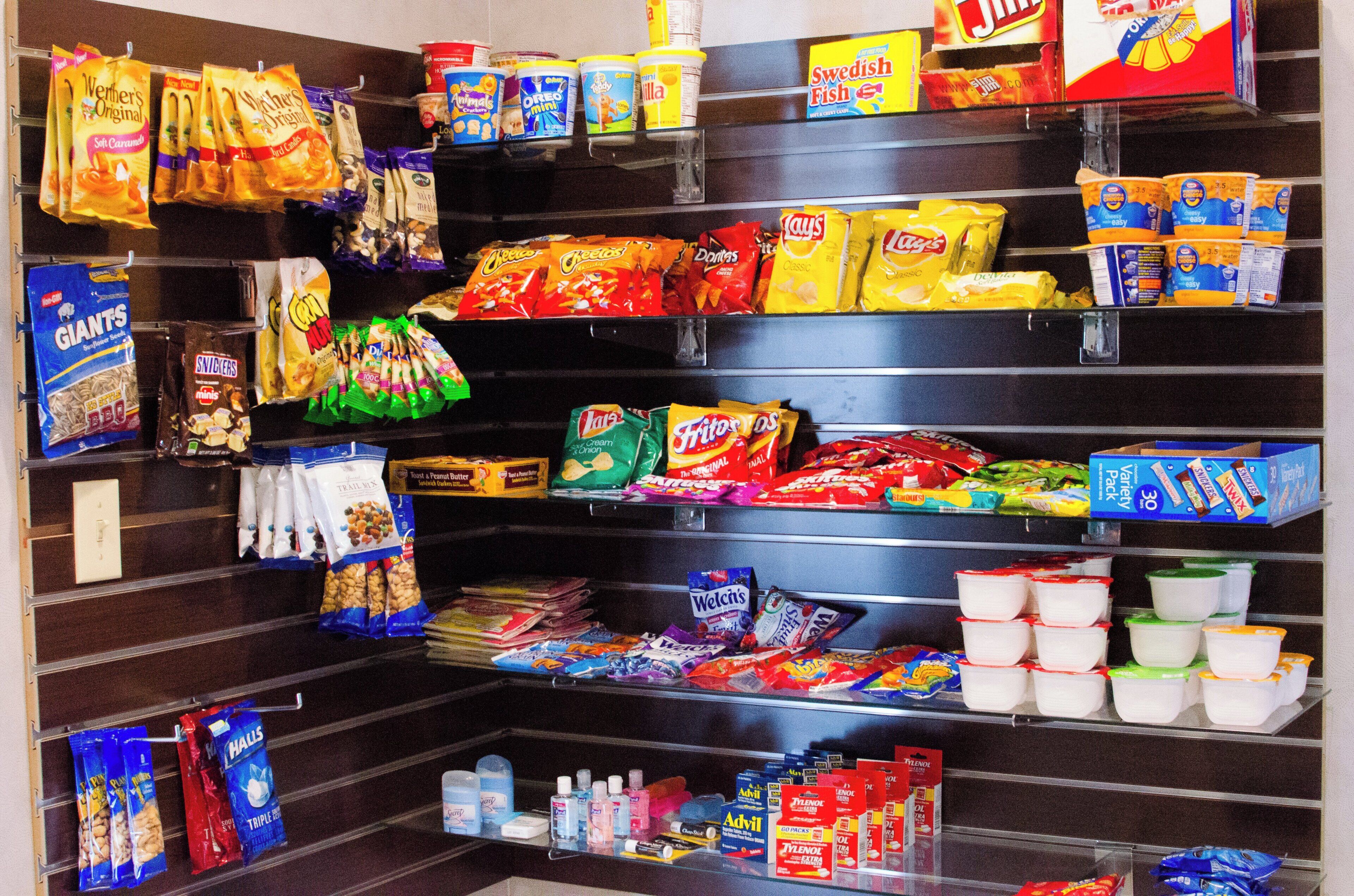A snack and dairy aisle with various products.
