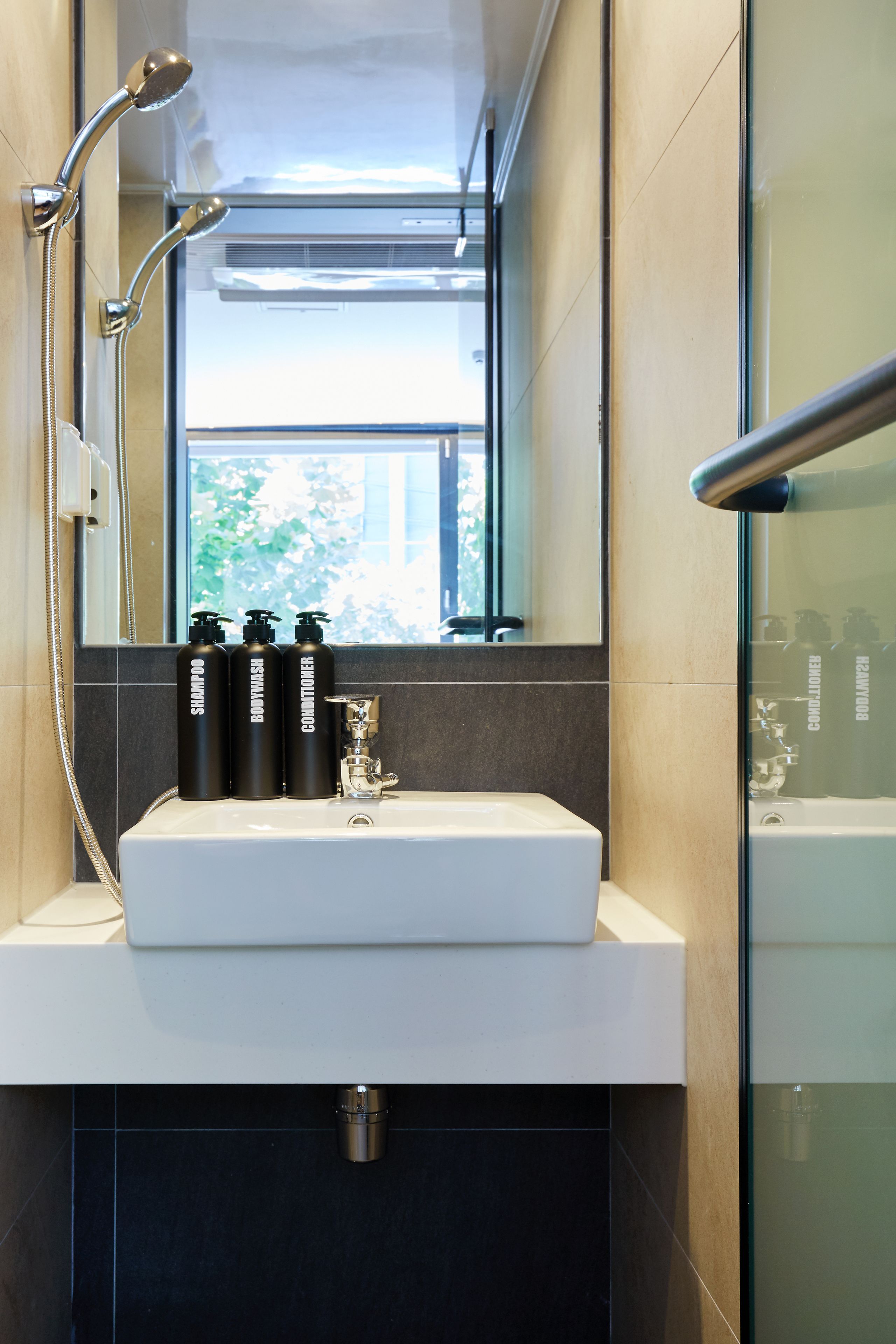 shower, hair dryer, slippers, towels