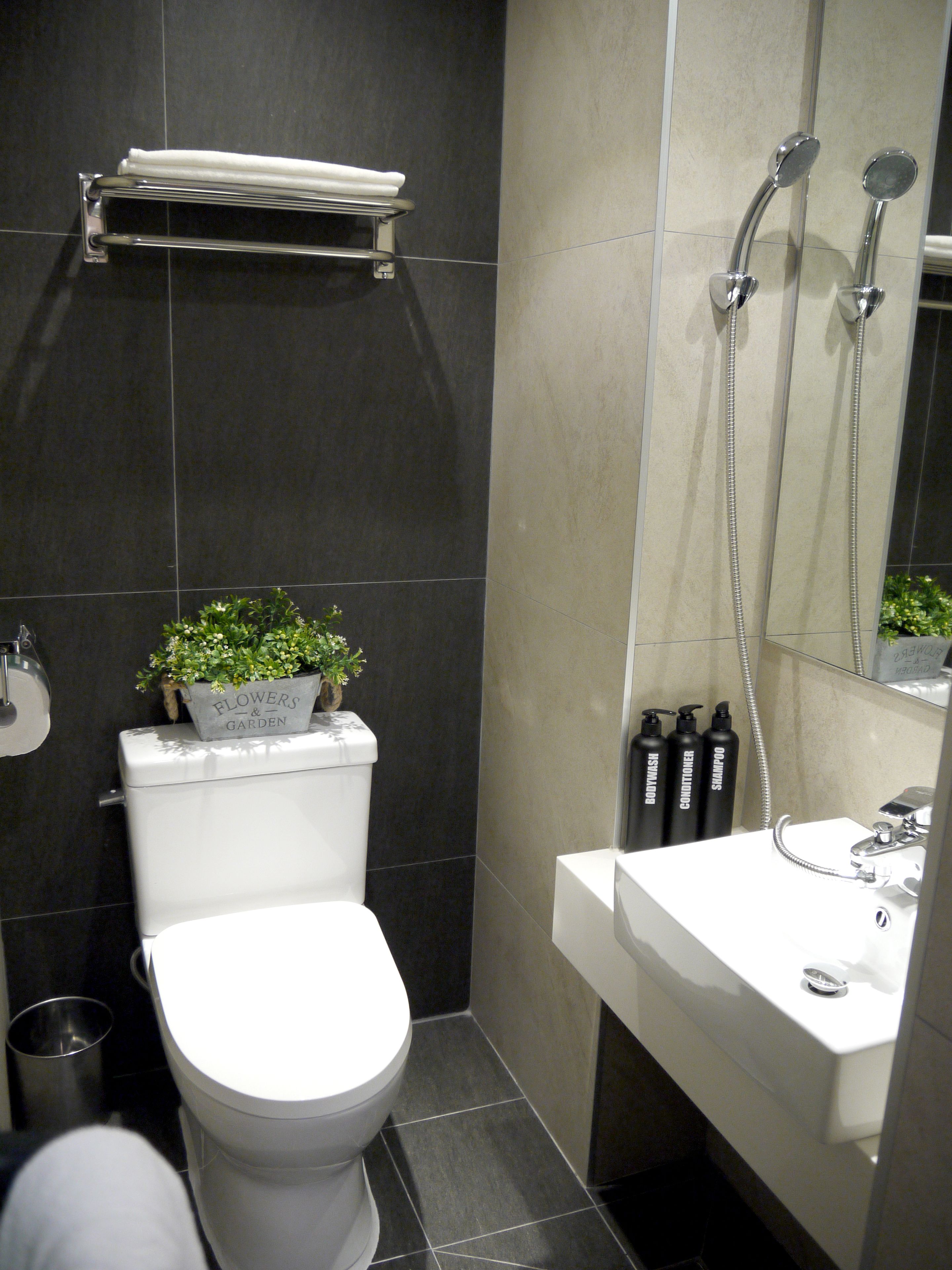 shower, hair dryer, slippers, towels