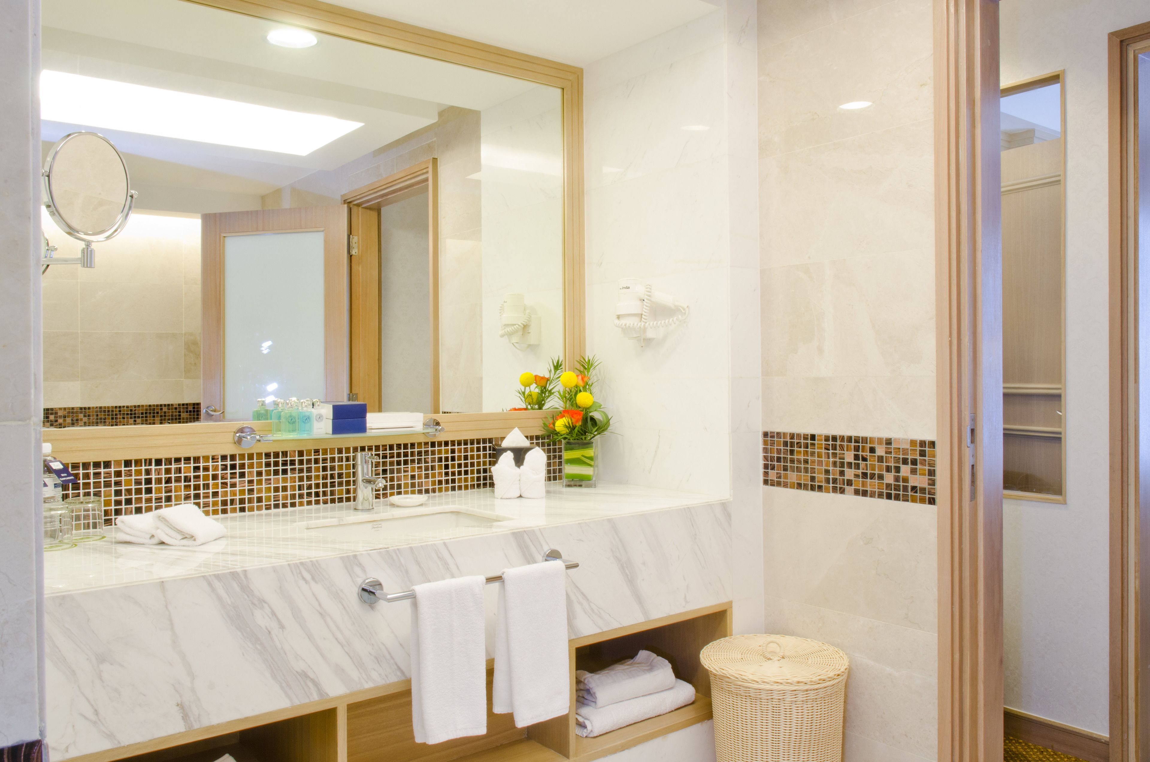 deluxe suite | bathroom | rainfall showerhead, free toiletries, hair dryer, slippers