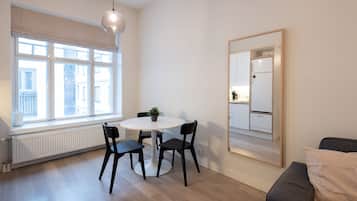 Basic Apartment | Living area | 32-inch TV with cable channels