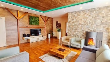 Exclusive Apartment, 2 Bedrooms, Fireplace | Living area | LCD TV, fireplace